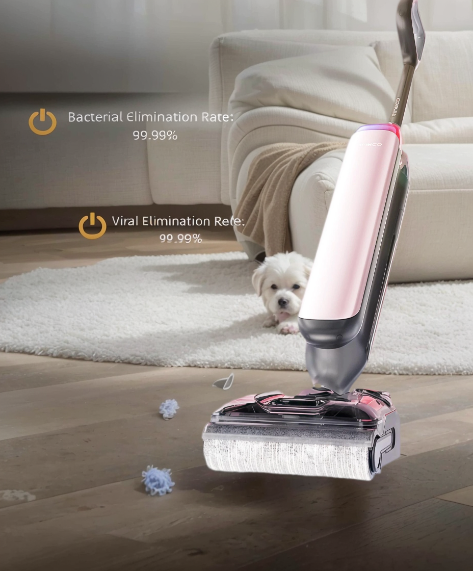 Tineco FLOOR ONE S7 Artist Wet Dry Vacuum Cleaner  wet/dry vacuum cleaning a hardwood floor in a living room with a small white dog in the background, showcasing its ability to eliminate 99.99% of bacteria and viruses for a deep, hygienic clean.