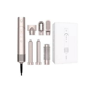 Silver 6-in-1 Ultra Styler hair styling tool with all accessories displayed: concentrator nozzle, diffuser, round brush, flat iron, curling barrel, and box. Compact design for versatile styling at home or on travel.