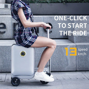 A person riding an Airwheel SE3S smart suitcase. The suitcase is silver with an integrated handlebar and wheels. The person is dressed in a checkered outfit and white sneakers. The text overlay reads, 'ONE-CLICK TO START THE RIDE' and '13 speed km/h.