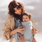 Mother and baby enjoying outdoor time together using BabyBjörn Harmony Carrier Mesh – breathable mesh keeps both cool and close during walks or errands
