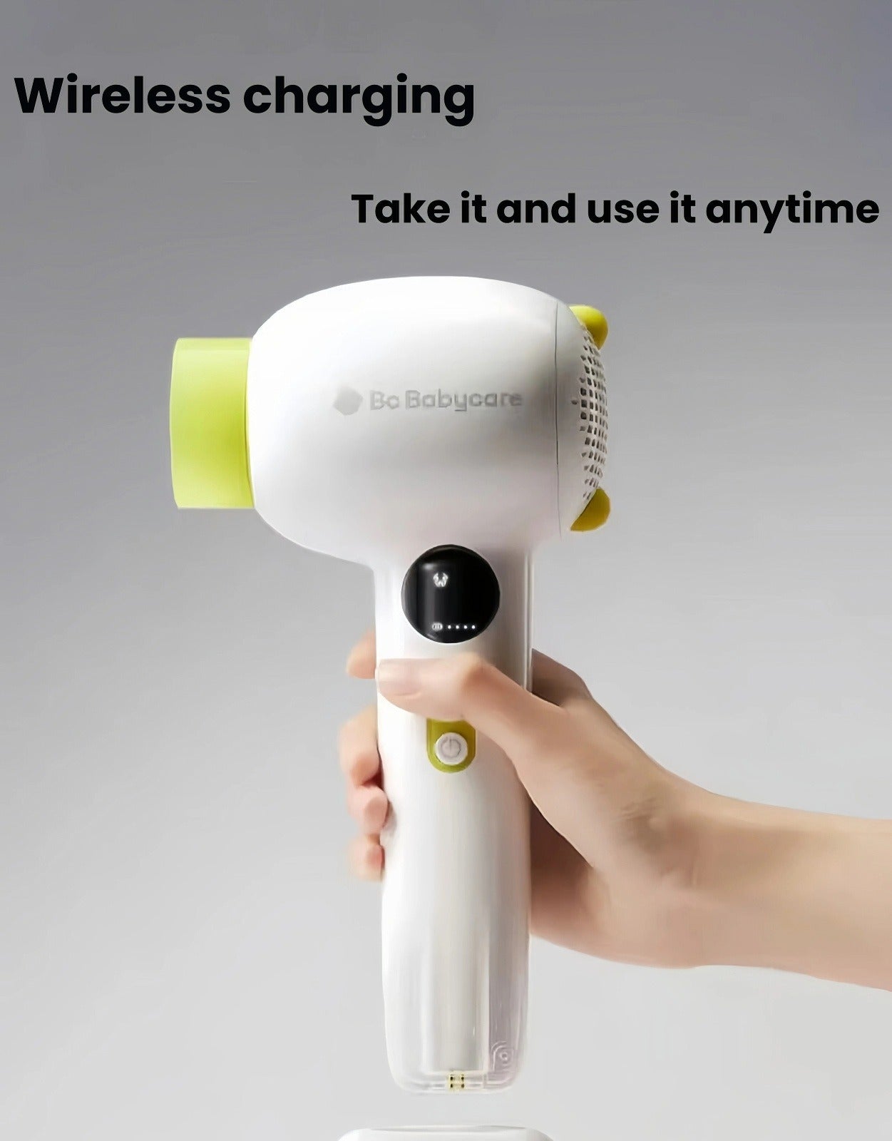 Parent placing Babycare cordless baby hair dryer onto wireless charging base, enabling quick recharging without cords for anytime use