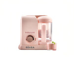 Beaba Babycook Solo baby food maker in soft pink color, featuring a transparent blending cup and one-click operation—ideal for making smooth, homemade baby purees safely at home.