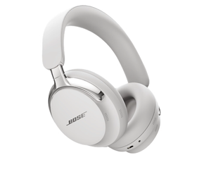 A pair of Bose QuietComfort Ultra Noise Cancelling Headphones in the White Smoke color, angled to showcase their sleek over-ear design, premium materials, and metallic accents on a white background