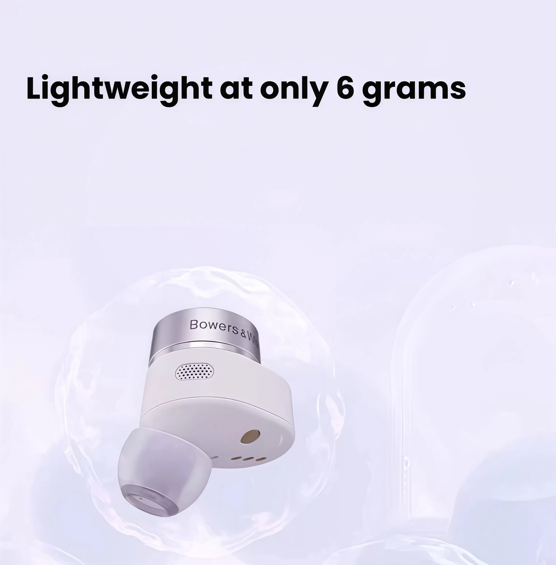Bowers & Wilkins Pi5 S2 earbud floating inside a bubble, emphasizing its ultra-lightweight design at only 6 grams per earbud for all-day comfort.