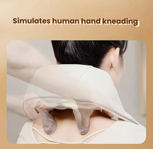 Back view of a woman using the Breo 3D neck and shoulder massager, showcasing how the dual massage heads mimic real human hand kneading for deep tissue relief and comfort.