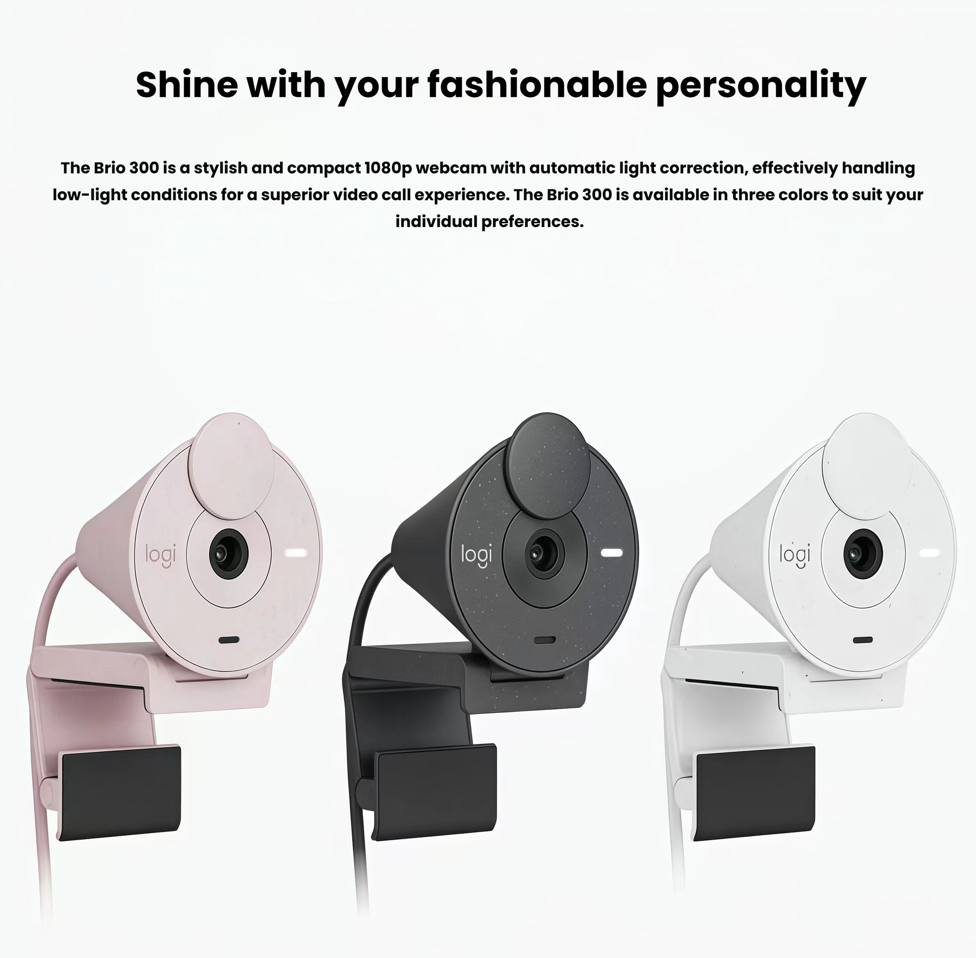 Row of three Logitech Brio 300 webcams in rose, graphite, and off-white finishes, each with the privacy cover closed.