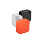Three CMF Buds 2a charging cases stacked together — orange, white, and black — showcasing the full color range, compact square design, and consistent branding across variants.