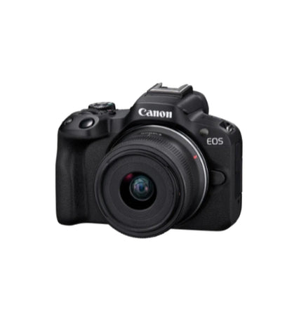 Studio ¾ front view of black Canon EOS R50 mirrorless camera with RF-S 18-45 mm kit lens attached.