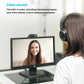 Lifestyle scene of a woman wearing a headset on a video call; the C270 webcam is mounted atop her monitor, demonstrating its built-in noise-canceling microphone.