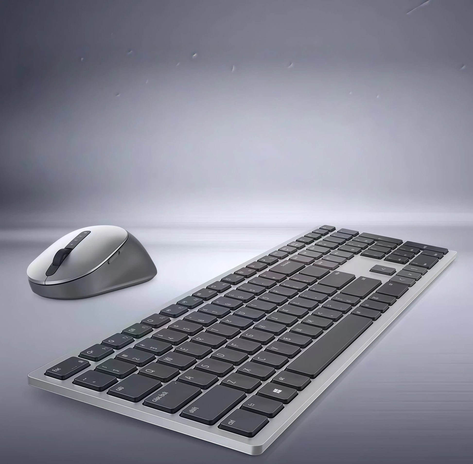 Side-angle studio shot of the Dell KM7321W wireless keyboard and mouse, showcasing the slim profile, matte finish, and modern design. The full-size keyboard features a numeric keypad and dedicated media keys, paired with an ergonomic mouse for comfortable long-term use.