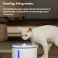 White cat observing Dogness simulated fountain with bubbling water flow; the flowing, living water design naturally attracts pets to drink more