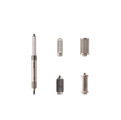 Full view of the Dreame AirStyle 6-in-1 hair dryer and styling tool with four included attachments: smooth round brush, diffuser, concentrator nozzle, and volume roller. Sleek metallic design with dual buttons for heat and airflow control.