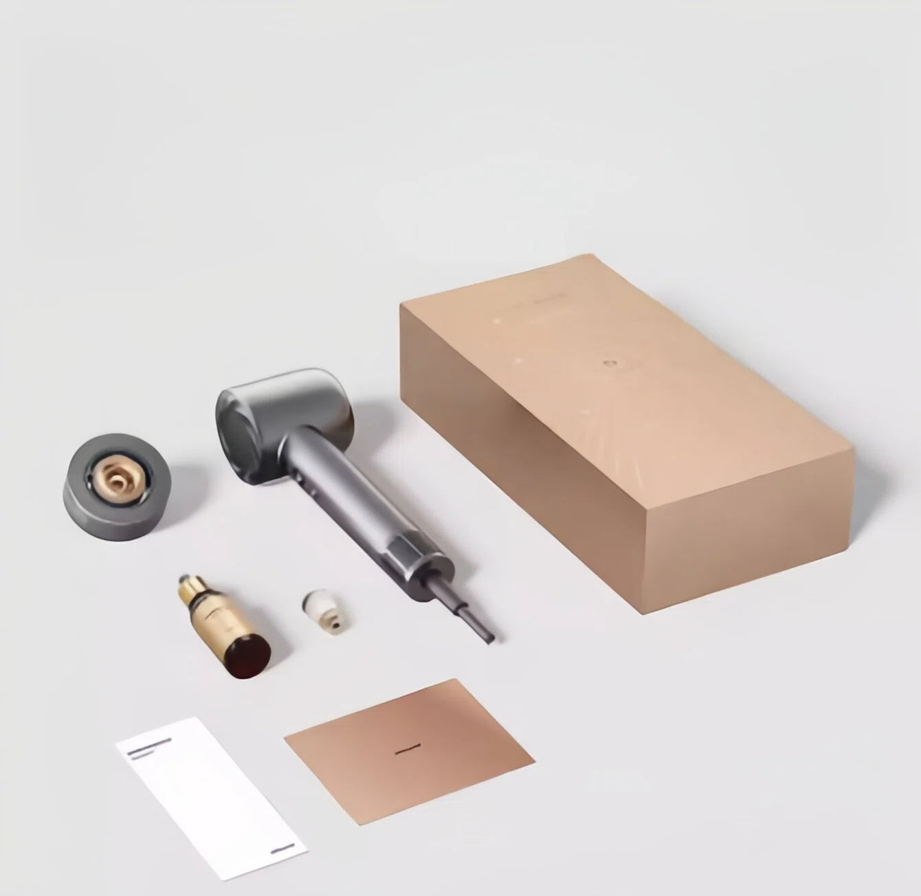 The complete Dreame Hair Glory Mix set unboxed, showing the space grey hair dryer, a magnetic styling nozzle, a hair essence bottle, and its sleek, minimalist packaging