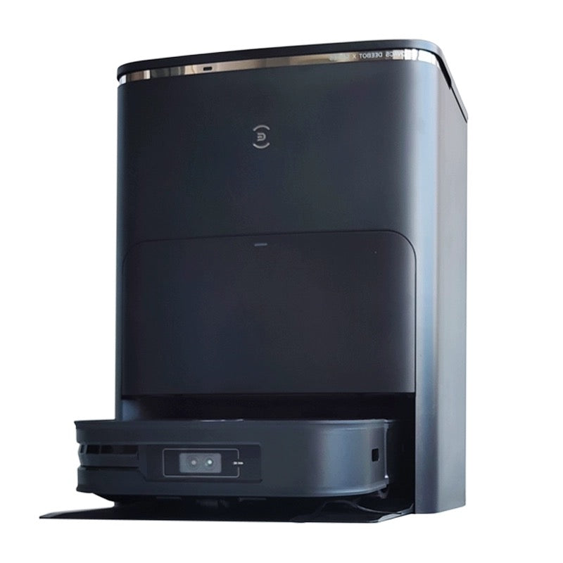 A black Ecovacs Deebot X2 Omni robot vacuum cleaner docked in its sleek, modern charging and cleaning station. The vacuum's front sensors are visible, and the station features a minimalistic design with a small logo on the front.