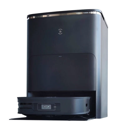 A black Ecovacs Deebot X2 Omni robot vacuum cleaner docked in its sleek, modern charging and cleaning station. The vacuum's front sensors are visible, and the station features a minimalistic design with a small logo on the front.