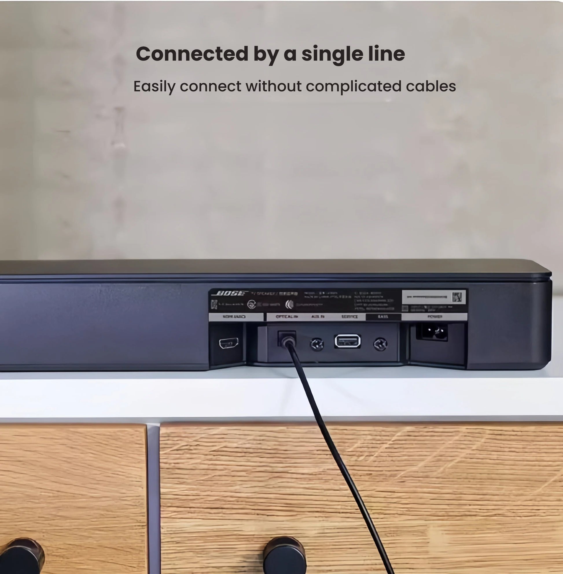 The back panel of the Bose TV Speaker showing the simple connection ports, including HDMI ARC and Optical, demonstrating the easy, single-line setup without complicated cables.