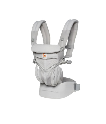 Studio shot of Ergobaby Omni Classic Mesh Carrier in light grey color—full-body breathable mesh, padded shoulder straps, and ergonomic seat design for newborn to toddler use.
