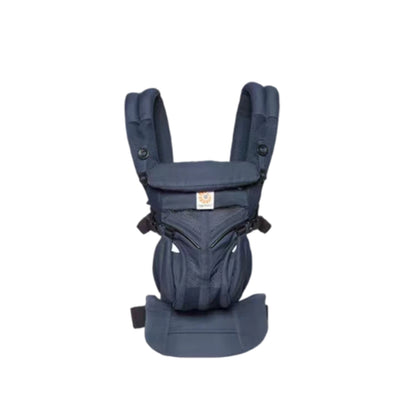 Studio shot of Ergobaby Omni Classic Mesh Carrier in navy blue—durable mesh fabric, adjustable waist belt, and secure buckles for safe and comfortable babywearing from birth.
