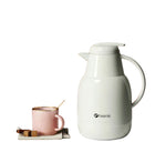 The elegant FEENIK 1-liter insulated jug in a clean white finish, featuring its leak-proof spout and logo, shown on a white background.