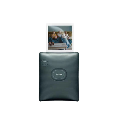 Fujifilm Instax Square Link smartphone printer in dark green with a printed square photo emerging. Features textured design, dedicated power button, and sleek compact build for portable instant printing.