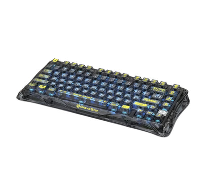 Top-down view of the GravaStar Mercury K1 Lite keyboard with transparent keycaps revealing internal components and blue backlighting. The clean, minimalist layout highlights the compact 75% form factor and ergonomic design, ideal for both typing and gaming.
