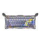 GravaStar Mercury K1 Pro mechanical keyboard with blue and white keycaps, full RGB illumination, and advanced anti-ghosting technology for responsive gaming input.