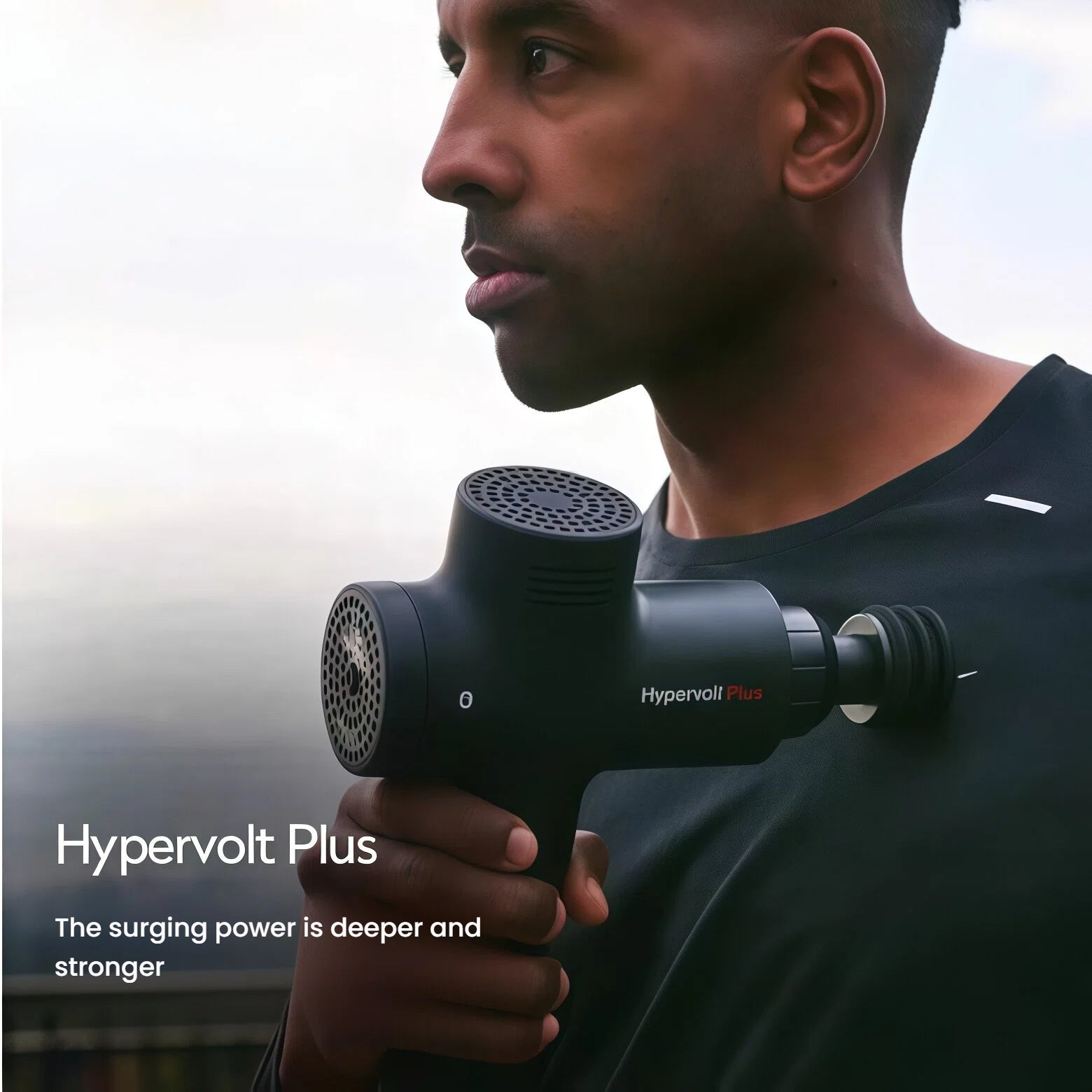 Athlete holding Hypervolt Plus against chest, highlighting powerful percussion therapy for post-workout recovery.
