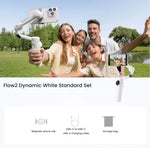 Dynamic White Insta360 Flow 2 AI Tracker Bundle laid flat—magnetic phone clip, USB-C cables, storage bag—official standard set.