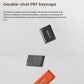 Close-up of Keychron K15 Max’s double-shot PBT keycaps in black and orange, featuring durable injection molding for resistance to oil buildup, staining, and fading over time.