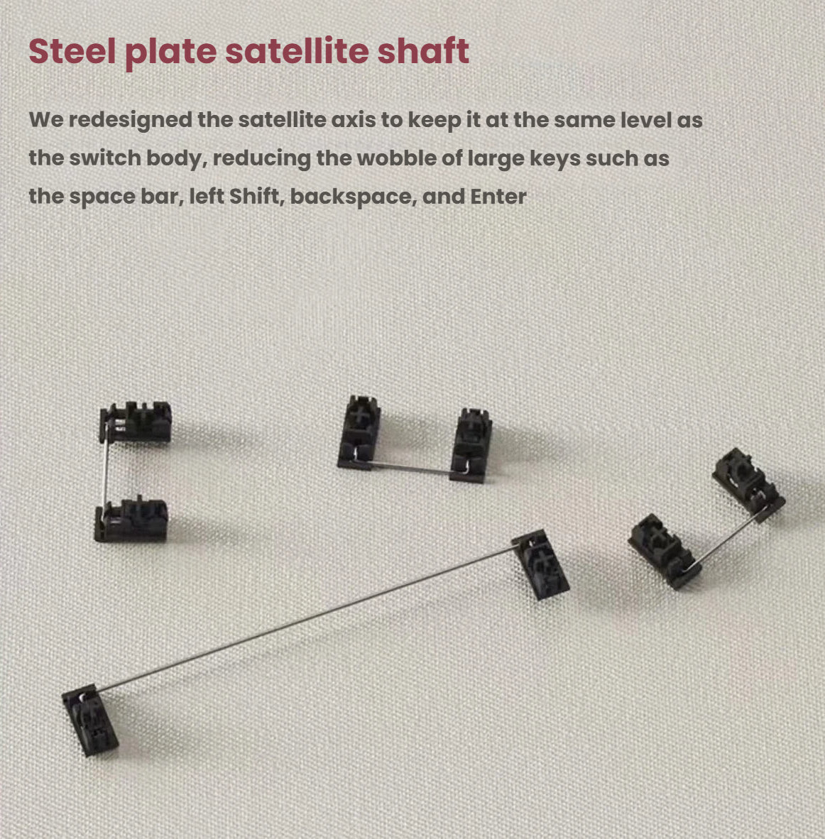 Detailed shot of Keychron K3 MAX steel plate satellite shafts designed to align with switch bodies, minimizing wobble in large keys like spacebar, shift, backspace, and enter for stable input.