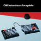 Keychron Q11 split mechanical keyboard with CNC aluminum faceplate, displayed on a blue and red gradient surface, highlighting premium build quality and sleek industrial design.
