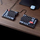 Keychron Q11 split mechanical keyboard on a wooden desk with wireless mouse and laptop, demonstrating ergonomic typing setup ideal for home office or professional workspace.