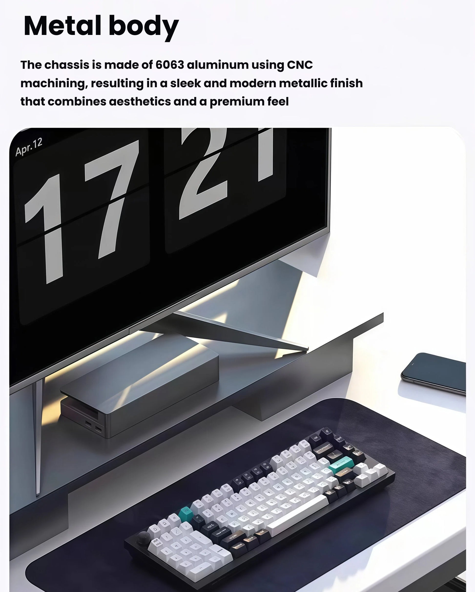 Keychron Q12 Max mechanical keyboard featuring a sleek CNC-machined 6063 aluminum chassis, placed on a modern desk setup with monitor and smartphone, showcasing premium build quality and minimalist design.