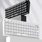 Stylized display of two Keychron Q15 Max keyboards — one black and one white — stacked vertically to showcase design symmetry, compact size, and dual-color options for personalized style.