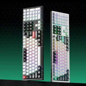 Side-by-side view of Keychron Q6 HE mechanical keyboards in black and white finishes, featuring full RGB lighting, PBT keycaps, and a sleek ergonomic layout for gaming and productivity.