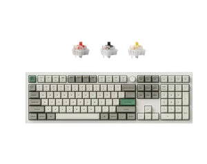 Front view of Keychron Q6 Max full-size wireless mechanical keyboard featuring white and olive green PBT keycaps, with three switch options (red, brown, blue) displayed above, ideal for typing and customization.