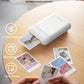 Liene x TELESIN portable photo printer on wooden table printing 2x3" ZINK photos. Features include Bluetooth connection, inkless printing at 30 ODPi, and self-adhesive backing for easy sticking to journals or gifts.