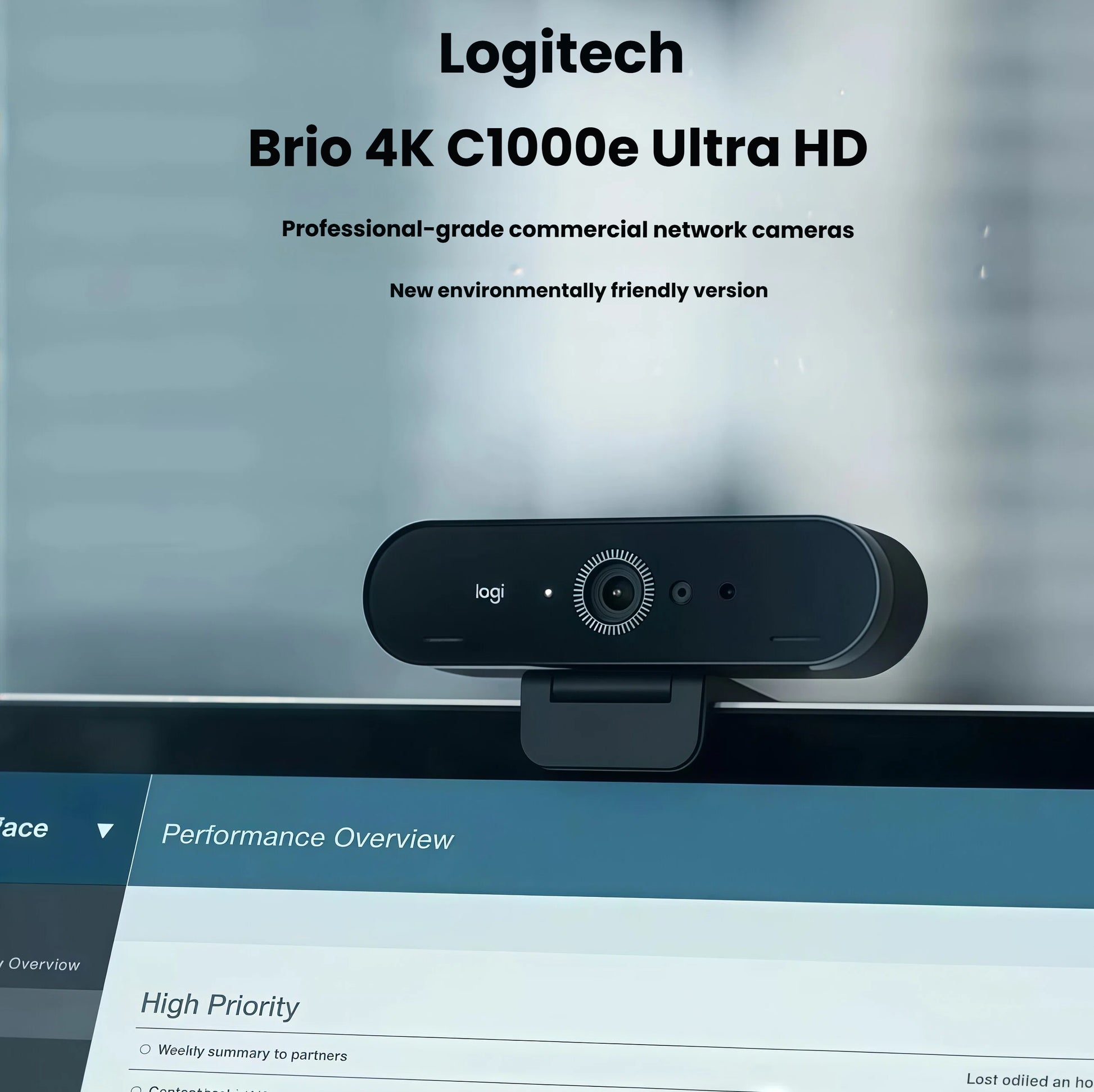 BRIO 4K webcam clipped to a monitor in a modern office, labeled as the environmentally friendly C1000e model for enterprise video conferencing.