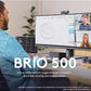Lifestyle scene of a professional using the Brio 500 webcam during a multi-participant video conference, highlighting automatic framing and display modes.