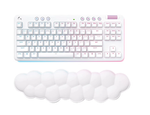 Top-down view of the white Logitech G715 tenkeyless wireless gaming keyboard paired with its signature fluffy cloud-shaped palm rest, showcasing pastel RGB underglow and compact 87-key layout.