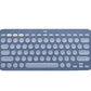 Soft blue-gray Logitech K380 keyboard from a top angle, showcasing its calming hue and the same compact, multi-device Bluetooth functionality.
