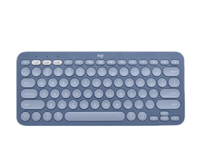 Soft blue-gray Logitech K380 keyboard from a top angle, showcasing its calming hue and the same compact, multi-device Bluetooth functionality.
