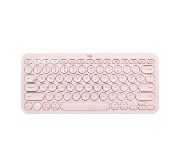 Overhead shot of the pastel-pink Logitech K380 Bluetooth keyboard, showcasing its chic round-key layout and compact form factor ideal for mobile workspaces.