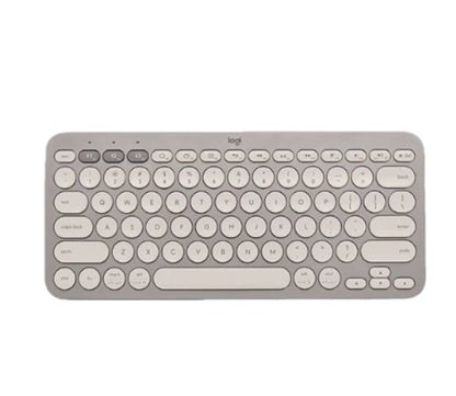 Neutral sand-colored Logitech K380 keyboard viewed from above, highlighting its understated tone and seamless compatibility with any modern device.