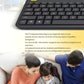 Family on a couch using the Logitech K400 Plus to navigate streaming content, highlighting the keyboard’s intuitive layout, volume hotkeys, and second left-click button for two-handed use.