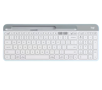 Clean overhead view of the off-white Logitech K580 wireless keyboard, highlighting its ultra-thin profile, integrated device slot, and quiet low-profile keys.