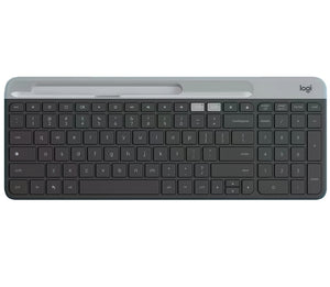 Overhead shot of the graphite Logitech K580 slim wireless keyboard, featuring a built-in phone/tablet cradle, full-size layout with numeric keypad, and dual-connectivity indicators.