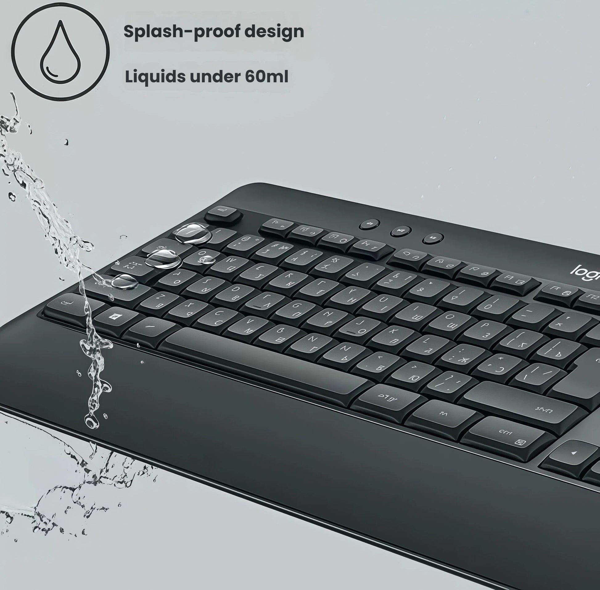 Close-up of water droplets splashing onto the MK540 keyboard, illustrating its durable, splash-proof design for worry-free daily use.
