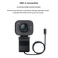 StreamCam in graphite shown with its USB-C cable, emphasizing plug-and-play compatibility with Windows 10 and macOS 10.14+ for high-speed video transfer.