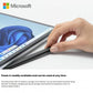 Hand inserting the Microsoft Surface Slim Pen 2 into the magnetic slot of the Surface Pro Keyboard Cover 2. The pen is ready to use out of the box and charges wirelessly when stored securely in compatible accessories.